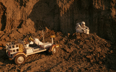 Astronaut kneeling beside lunar rover operating scientific instrument on red planet