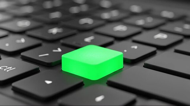 Close-up 4k shot showing a bright green button illuminated on a dark, slightly blurred modern keyboard with focus on the vibrant key and muted background.
