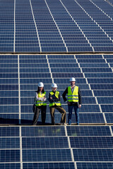 Engineers team working on solar panel field