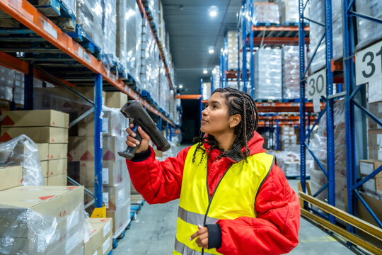 Woman scanning inventory in cold storage warehouse logistics