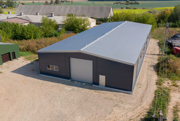 Modern Industrial Farm Warehouse Building in a Rural Area Aerial View