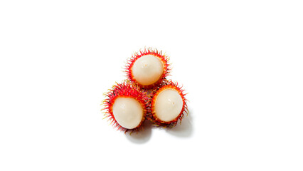 Close-up of three fresh tropical rambutan fruits with red hairy skin and white juicy flesh, isolated on a clean white background.