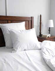 Obraz premium Bedroom Serenity White Bedding and Wooden Headboard