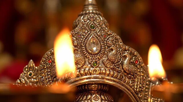 Skanda Sashti Celebration Close-Up of Ornate Oil Lamp with Flames and Precious Gemstones for Spiritual Observance