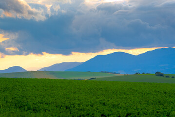 Countryside landscape with mountains and clouds