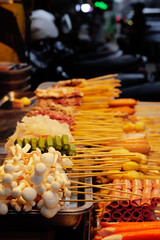 Thai-Asian style barbecue meatballs called 'Mala' served with a rich chili sauce sold as street food.