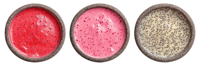 Three bowls of colorful berry smoothies with seeds