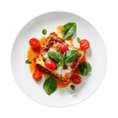 Layered lasagna with basil, tomatoes, on a white plate