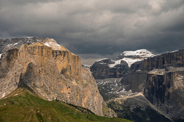 Sella mountain range and Sasso Pordoi images from Col Rodella with a cloudy sky in the background, Dolomites, Italy