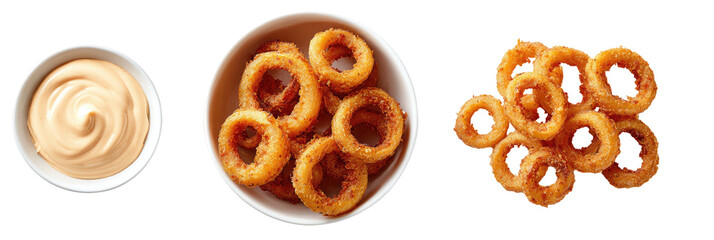 Fried onion rings with creamy sauce in bowls, on black