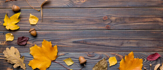 Autumn composition. Pattern made of dried leaves and other design accessories on table. Flat lay, top view