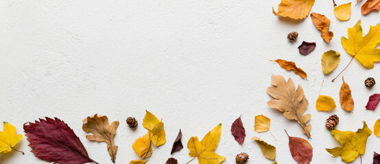 Autumn composition. Pattern made of dried leaves and other design accessories on table. Flat lay, top view