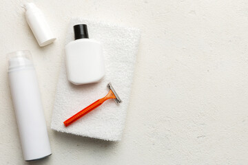 shaving man set. shaving machine, towel, lotion and shaving foam on colored background. Men bath Accessories top view