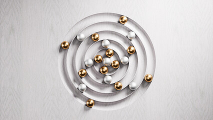 Silver and gold spheres rolling on concentric circles carved on wood
