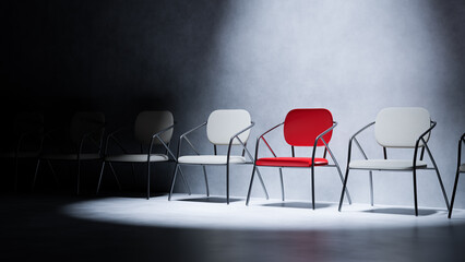 Spotlight on a bold red chair in a row of neutral seats