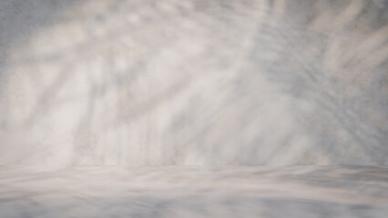 Empty room with concrete floor and blurred shadows on wall