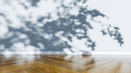 Empty room with wooden floor and shadows on the wall