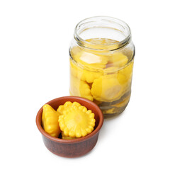 Pickled pattypan squashes in glass jar and bowl isolated on white