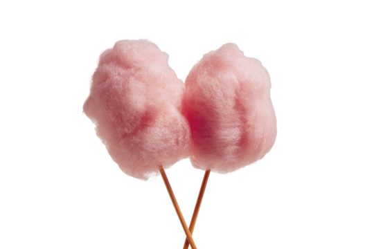 Two pink cotton candy puffs on sticks, dark backdrop