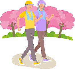 Senior women walking under cherry blossom trees in spring