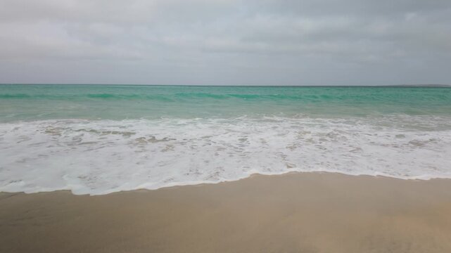 Atlantic Ocean waves breaking on the shoreline of the Cape Verde island of Boa Vista.