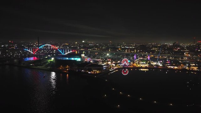 Panoramic drone shot around the illuminated Hoan park, fireworks in Milwaukee