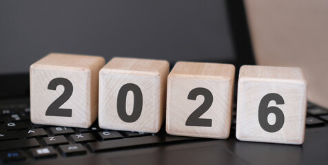 2026 concept. Wooden cubes on a computer keyboard