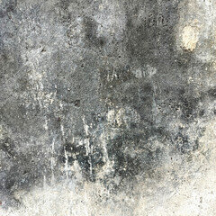 Old damaged concrete wall with mold and cracks texture. Grunge dirty surface with moisture stains and rough cement pattern. Vintage background for design, construction, or urban decay concept.