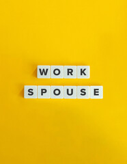 Work Spouse Text on White Letter Tiles over Yellow Background