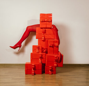 Red high heels and gloves with stacked presents in a cabaret monochrome scene
