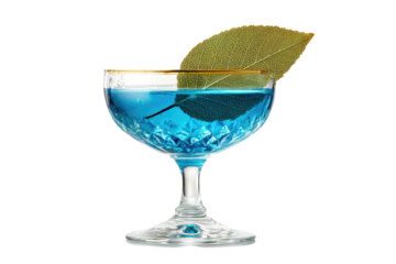 Blue drink in cut crystal glass, garnished with a big leaf