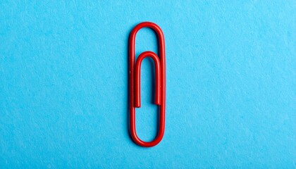 Conceptual Art: Red Paperclip on Monochrome Field