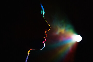 Colorful silhouette of woman in neon light projecting virtual reality
