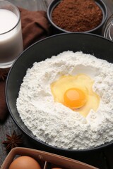 Ingredients for dough on wooden table, closeup