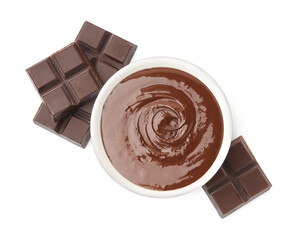 Bowl with melted chocolate and pieces isolated on white, top view