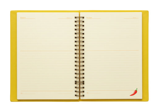 Isolated spiral-bound recipe notebook journal with blank pages, yellow cover, chili pepper