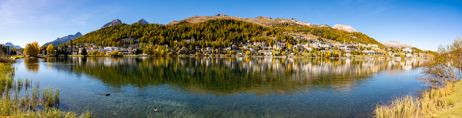 The village and lake of St. Moritz in autumn, with the trees turning color. Engadine, Switzerland.