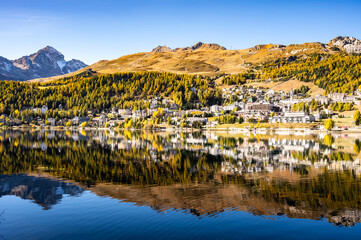 The village and lake of St. Moritz in autumn, with the trees turning color. Engadine, Switzerland.