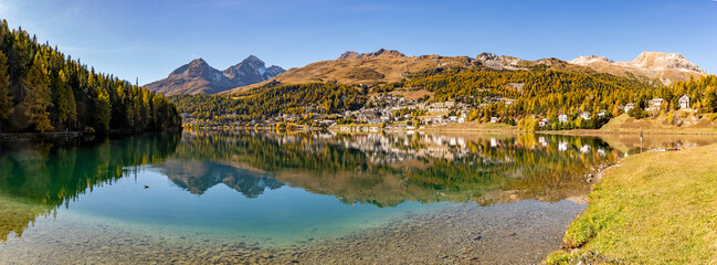 The village and lake of St. Moritz in autumn, with the trees turning color. Engadine, Switzerland.