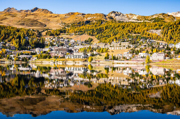 The village and lake of St. Moritz in autumn, with the trees turning color. Engadine, Switzerland.