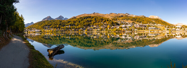The village and lake of St. Moritz in autumn, with the trees turning color. Engadine, Switzerland.