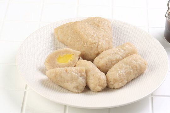 Indonesian pempek fish cake served on white plate, authentic Palembang traditional food with savory taste. Perfect for culinary stock image.