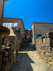 Stone alley stairs leading to old village houses