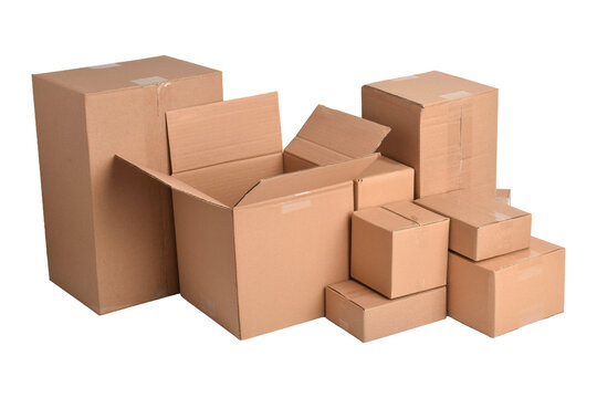 Stacked brown cardboard boxes in various sizes isolated on white background
