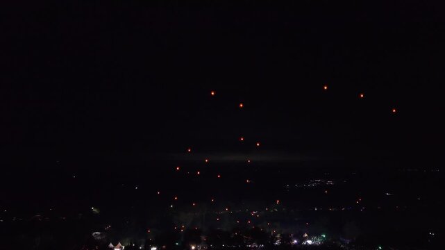 Aerial view of glowing lanterns against the night sky at the Parangtritis Lantern Festival, a beautiful sight, Yogyakarta, Special Region of Yogyakarta, Indonesia.