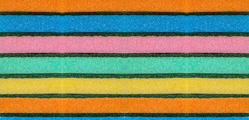 Colorful sponges for dishwashing filmed in a row