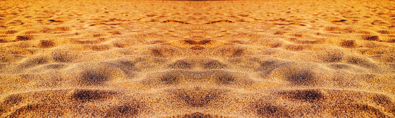Sunset on the beach. Sand texture.