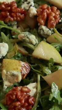 fall pear salad with blue cheese preparation close up