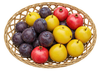 Isolated fruit in basket assortment of fresh pomegranates plums and nashi pears on white