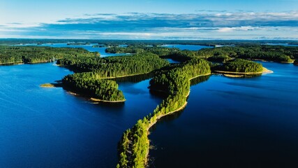 Explore the stunning landscape of Punkaharju, Finland, featuring the twisting Esker road surrounded...